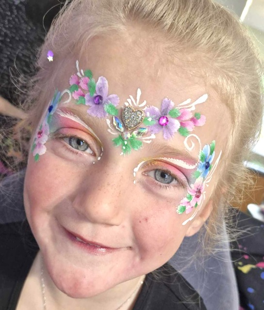 irl with flower face paint in Telford